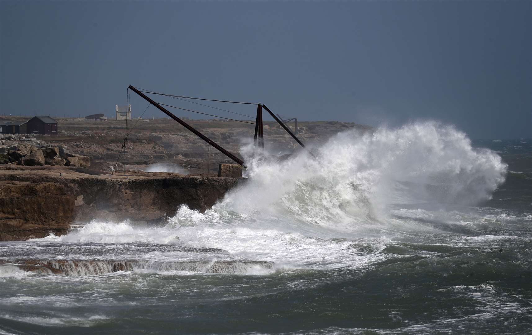 Waves crash against the shoreline at Portland Bill in Dorset (Andrew Matthews/PA)