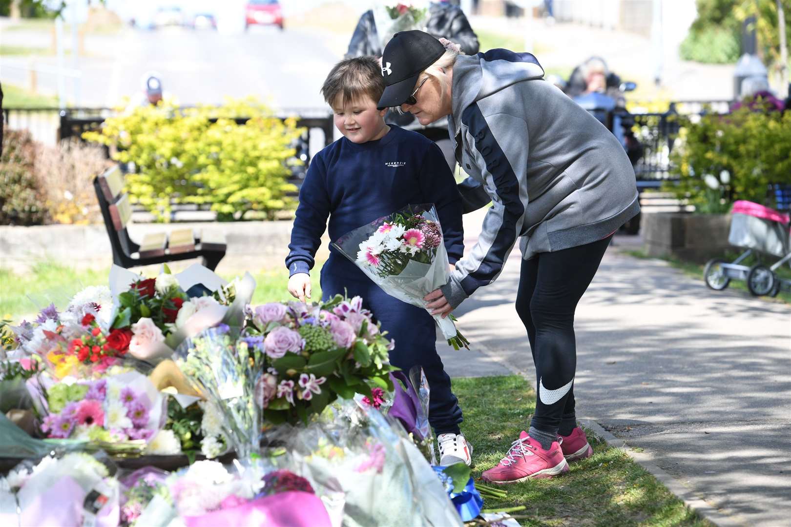 Mourners lay floral tributes in a park in Aylesham village (Kirsty O’Connor/PA)