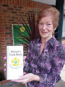 Ann Lynch and her cook book in memory of her son Kieran