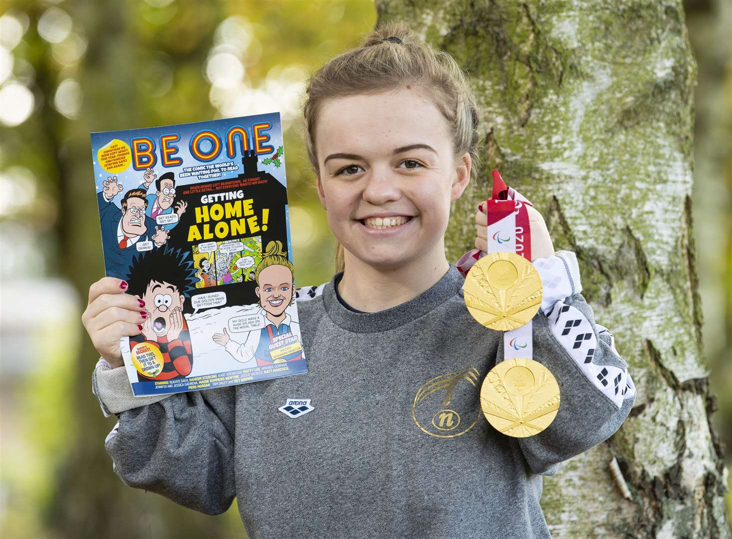 British Paralympic swimmer Maisie Summers-Newton launches the special edition ‘BeONE’ comic, by Beano, celebrating British Sporting achievements of 2021 (Doug Peters/PA)