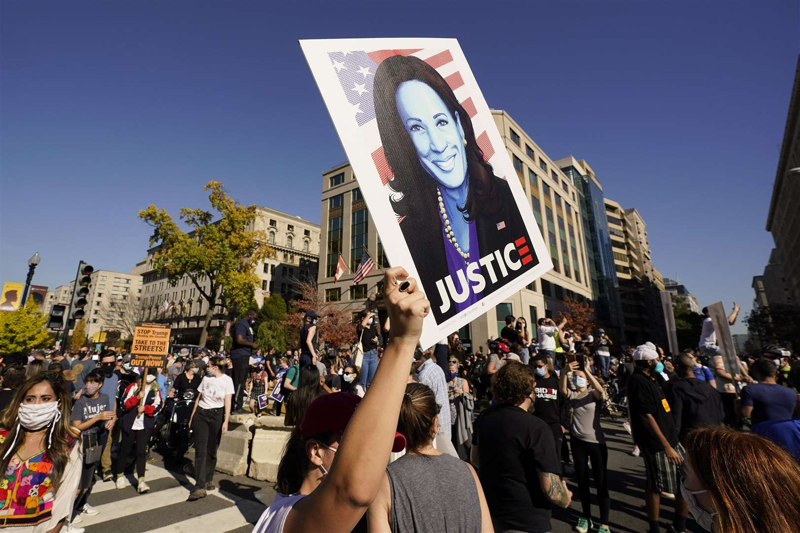 A Kamala Harris fan in the Black Lives Matter Plaza in Washington (Alex Brandon/AP)