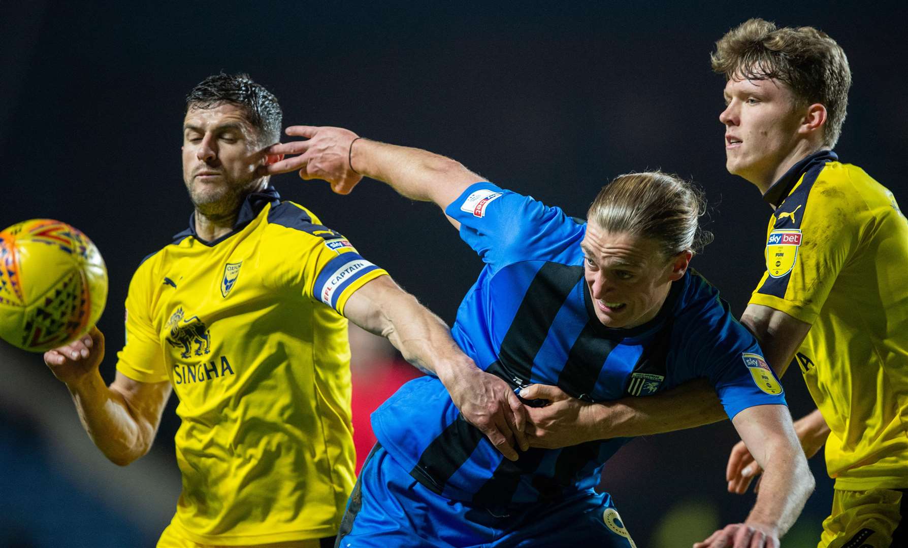 Tom Eaves is manhandled by John Mousinho and Rob Dickie Picture: Ady Kerry