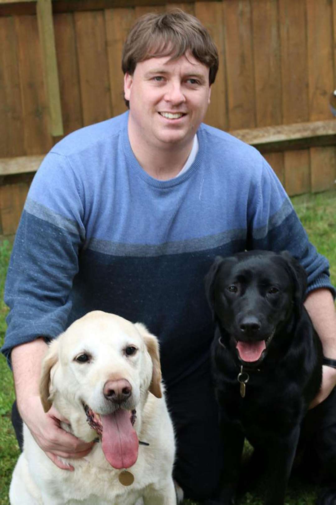 Frankie Tipton with Victoria and his previous guide dog, Bentley (left) (Thames Water/PA)