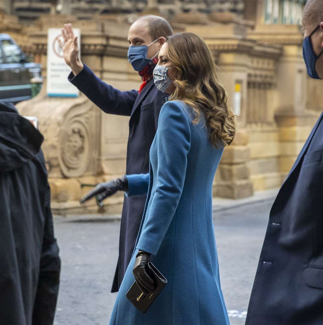 The duke and duchess of Cambridge wave to onlookers after their arrival (Andy Barr/PA)