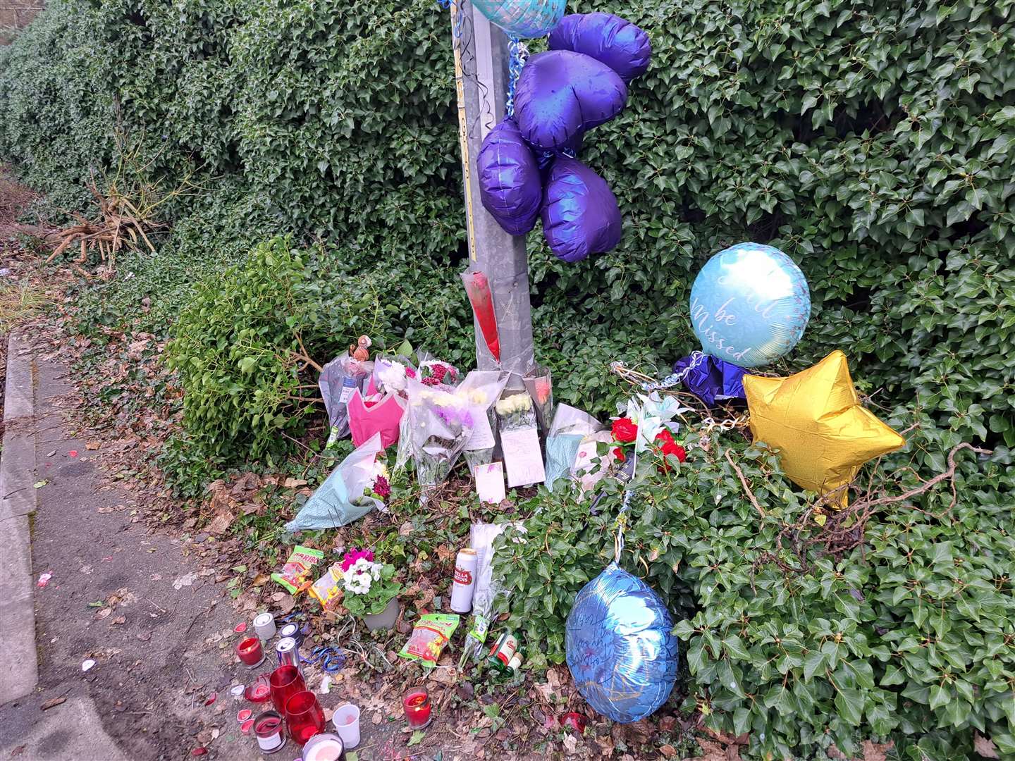 Flowers, notes and candles are among the items left in tribute to the victims