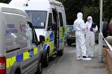 Police Forensic Investigators outside the house in Oak Road, Murston, where a 36-year-old man was stabbed to death