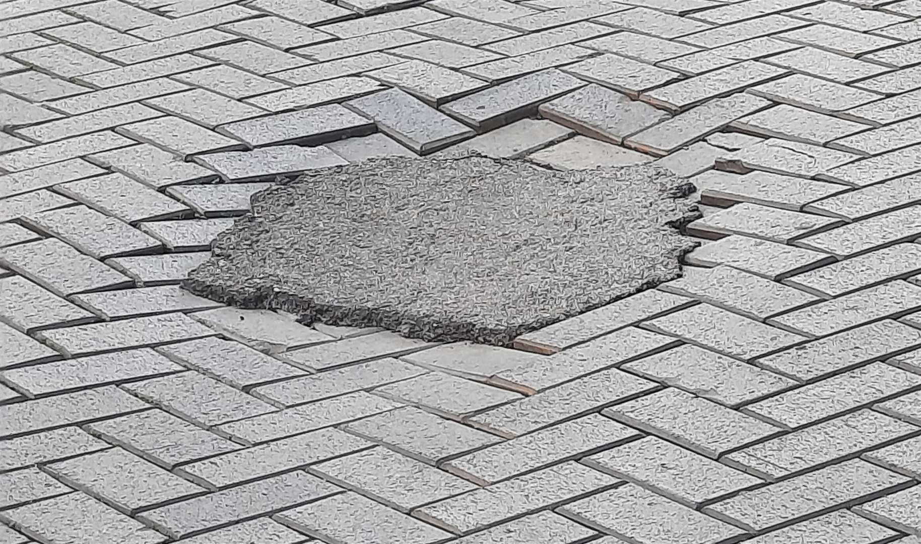 The patched paving in Biggin Street, Dover, has been branded “appalling”. Pictures: Martin Turner