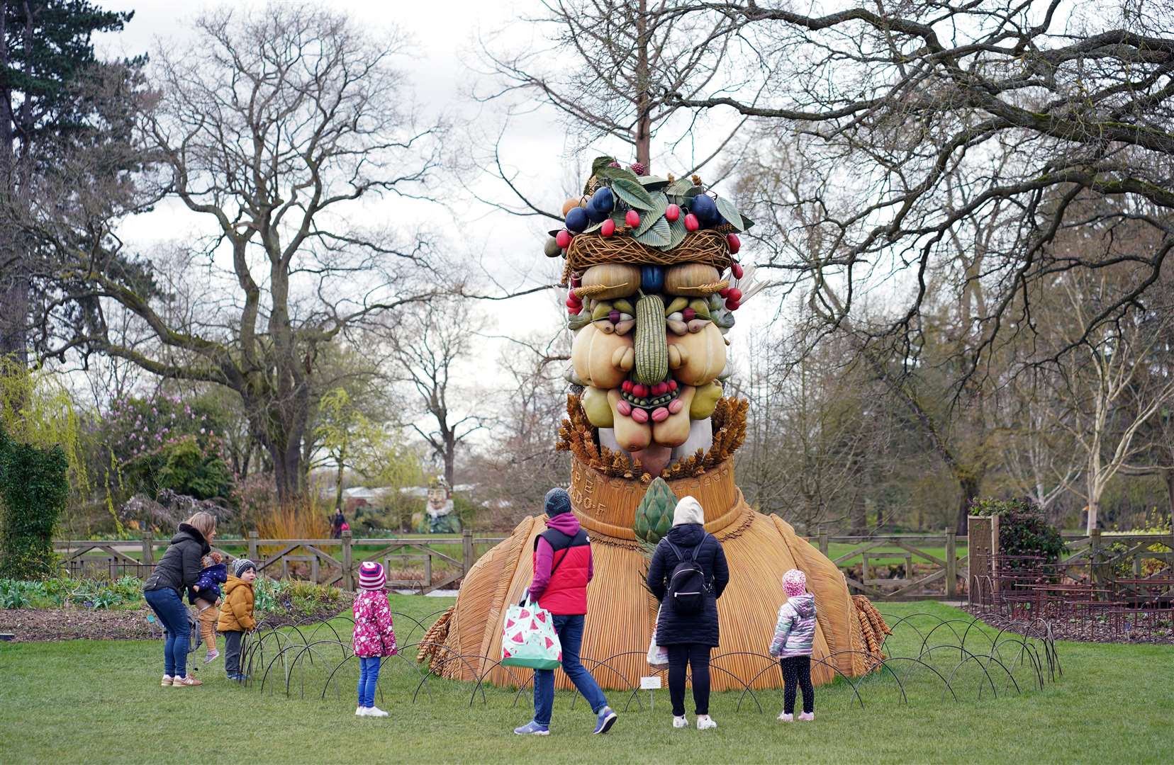 Despite lockdown measures looming, families ventured out to look at a sculpture at RHS Garden Wisley in Surrey (John Walton/PA)