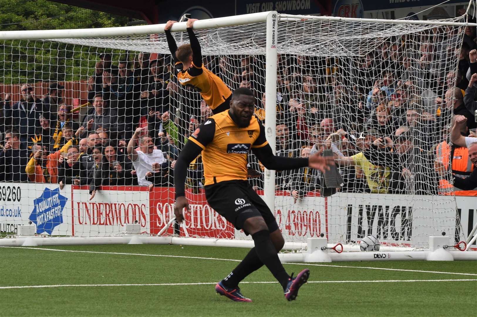 Jerome Binnom-Williams celebrates scoring Maidstone's fourth at Hemel, and Sam Corne seems pretty happy, too Picture: Steve Terrell