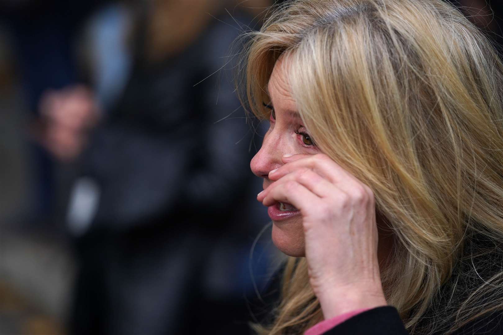 Penny Lancaster wipes a tear from her eye as she talks about the menopause during the rally (Steve Parsons/PA)