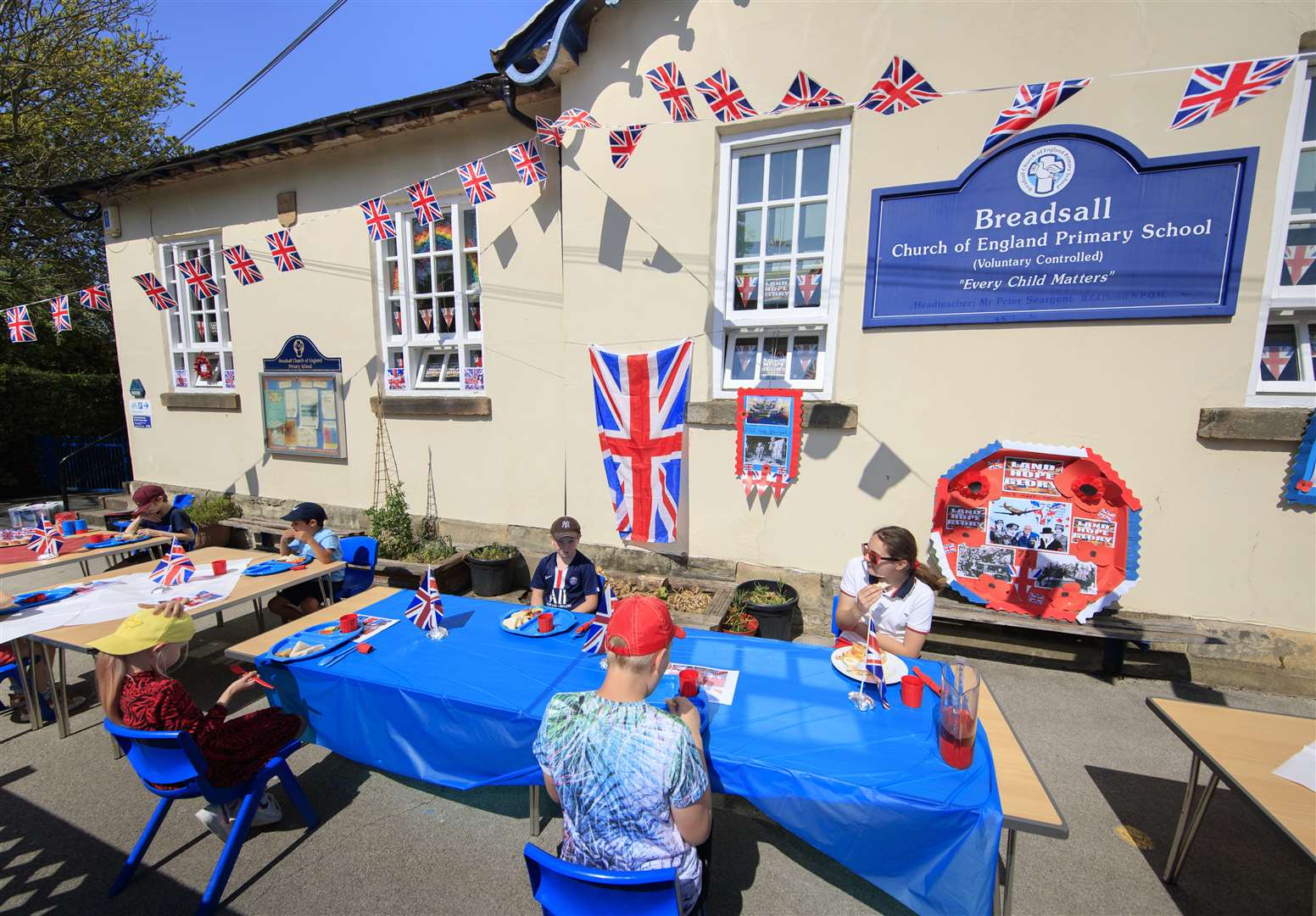 The children ate in front of a display about the importance of VE Day (Danny Lawson/PA)