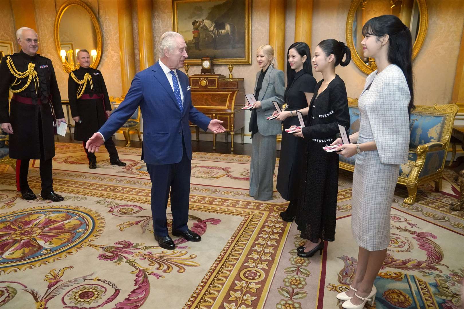 The King with members of the K-Pop band Blackpink at the Palace on Wednesday (Victoria Jones/PA)