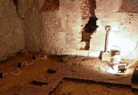 The remains of the original street entrance and the broken paving, at the undercroft, Wye