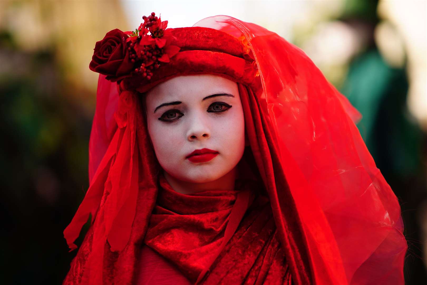 A Red Rebel takes part in the Funeral for Nature procession in Bath (Ben Birchall/PA)