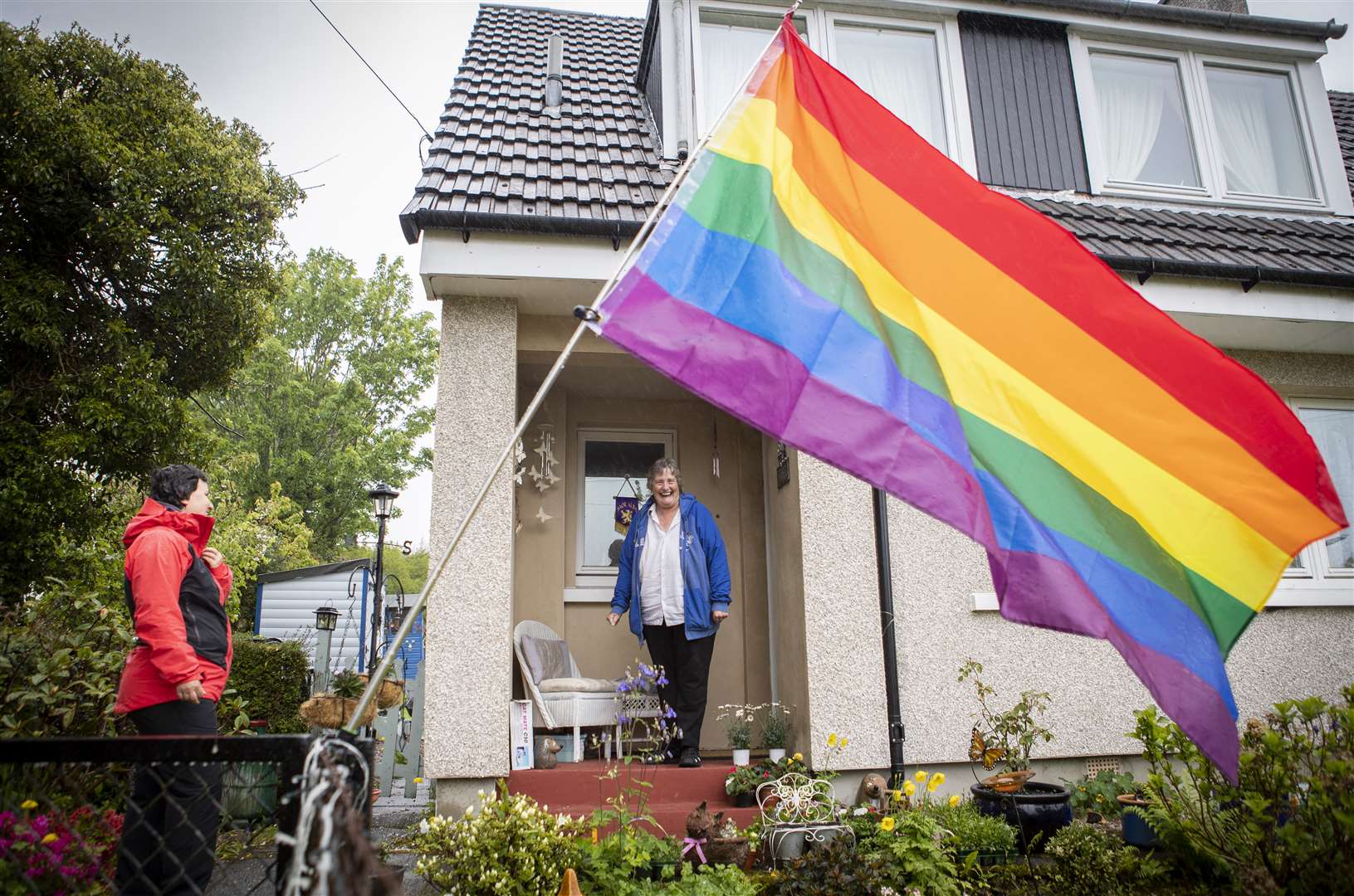 Becs Barker (left) chats to her neighbour Jan Brown on her doorstep (Jane Barlow/PA)