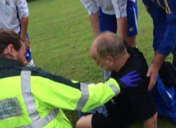 Referee Mick Brooks shortly after the punch