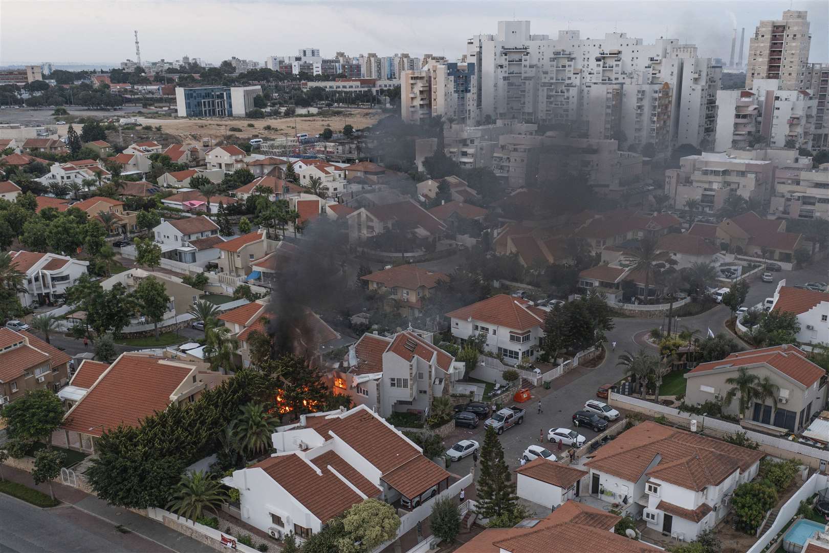 Smoke rises after a rocket fired from the Gaza Strip hit a house in Ashkelon, southern Israel (Tsafrir Abayov/AP)