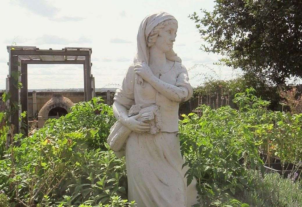 The secret garden is full of vegetables like tomatoes and cabbages