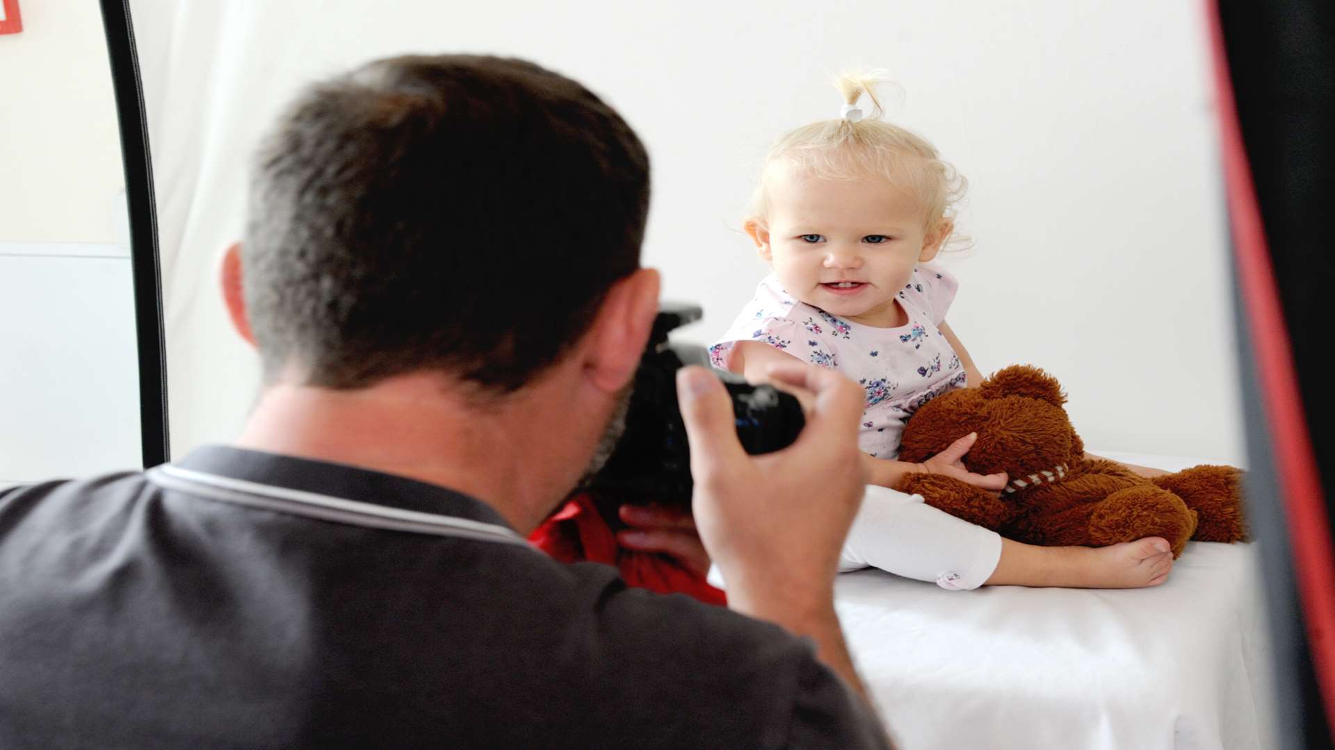 Andy Nield taking photos of Edith Wheeler, 14 months