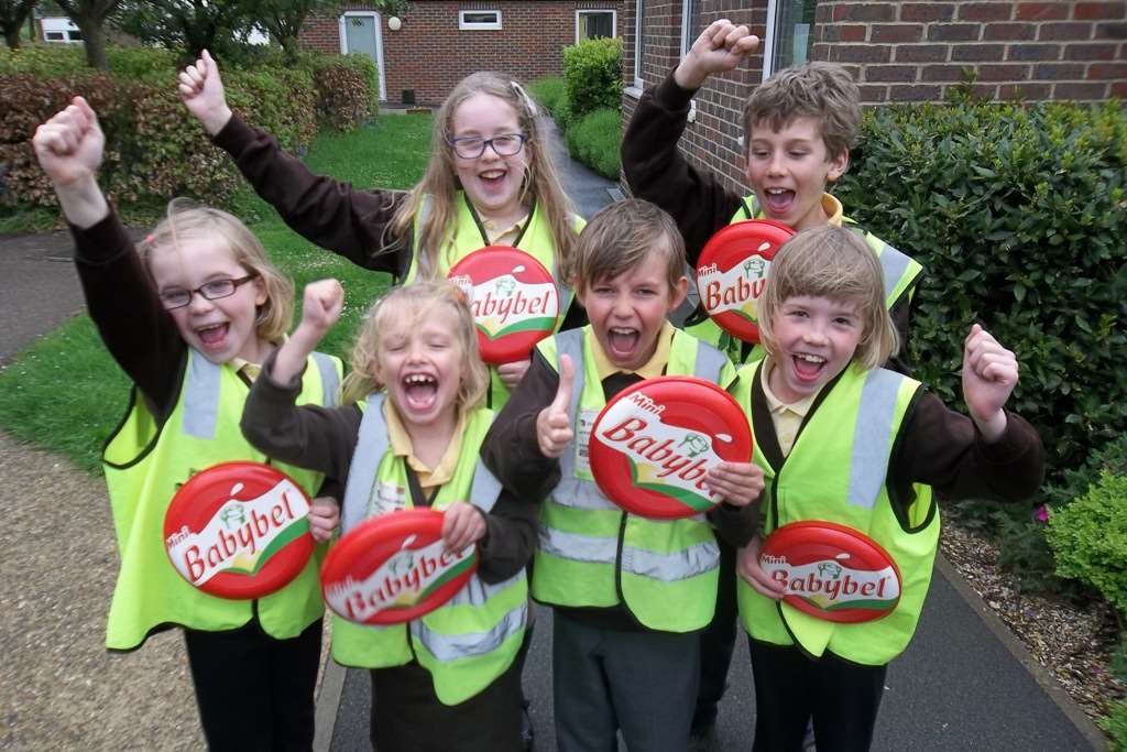 Martha Curry, seven, Grace Vickers, eight, Frank Curry, nine, Anna Vickers, eight, Alicia Farrant, 10 and Jonathan Rutland, 10, celebrate the school winning the first Babybel Best Walking Bus Award