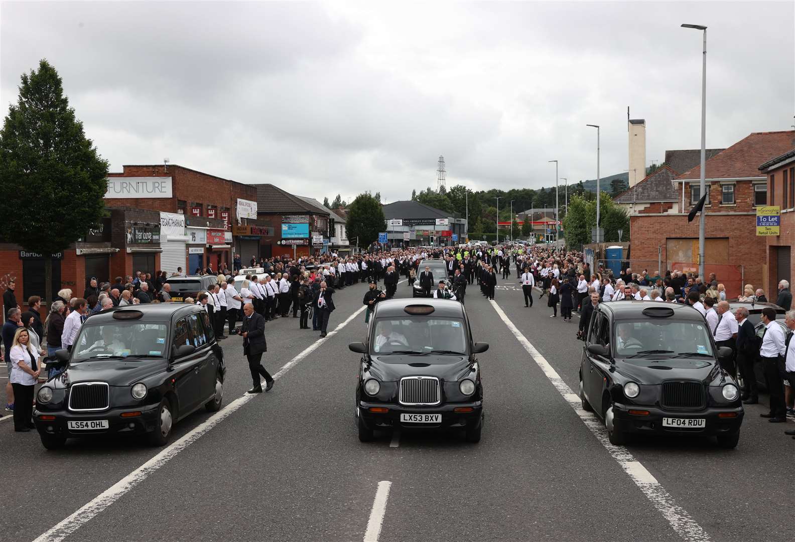 The ceremony prompted hundreds of people to line the route as the cortege passed through (Liam McBurney/PA)