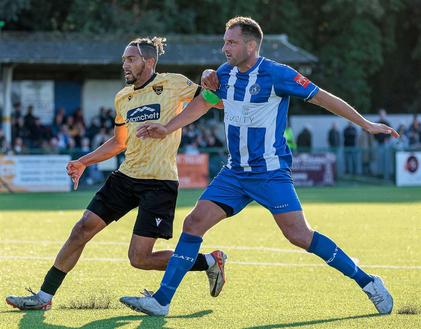 Liam Friend, Herne Bay's captain, holds off Maidstone substitute Matt Bentley. Picture: Helen Cooper