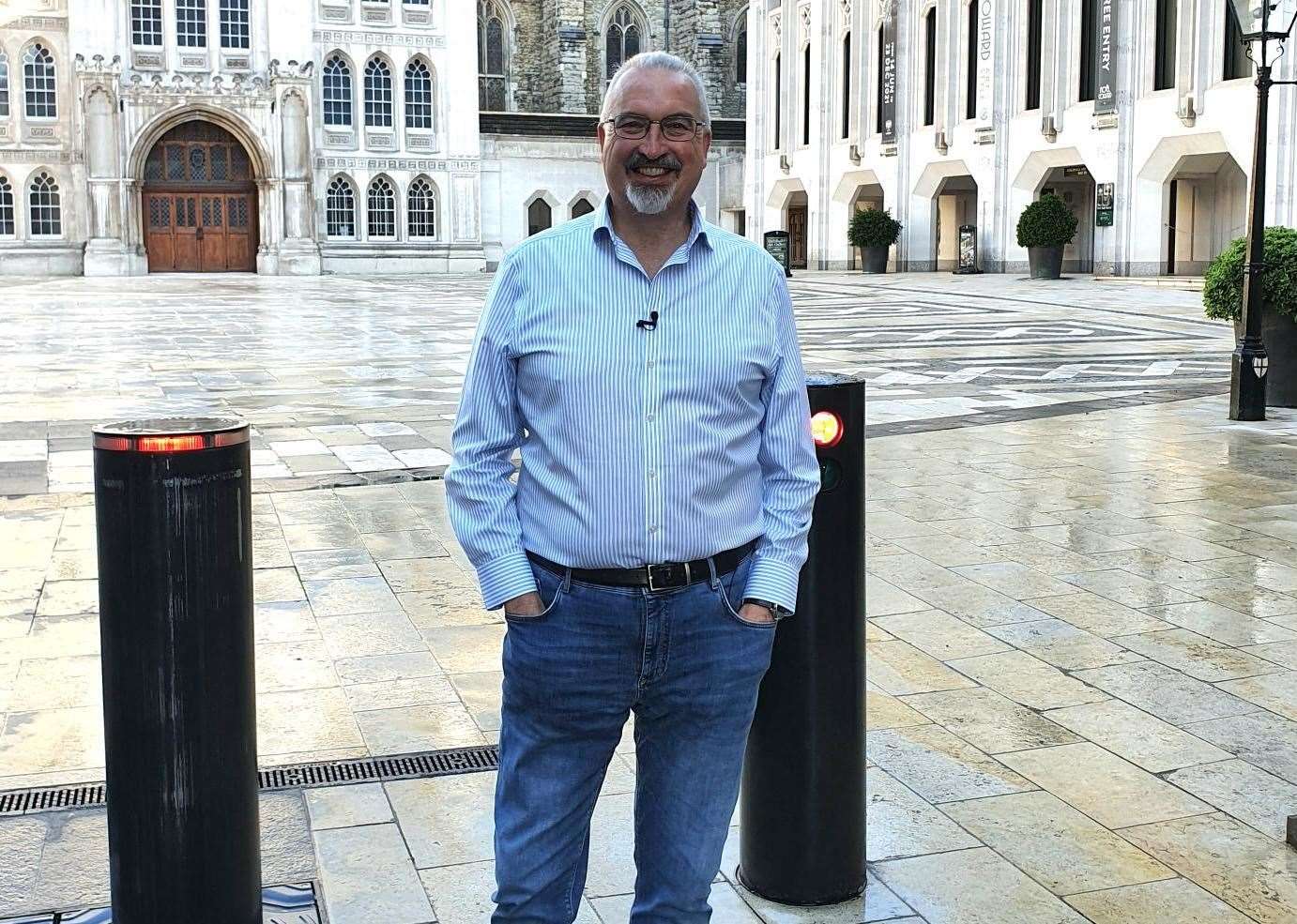 Dr Simon Elliott at the Guildhall courtyard in the City of London, standing above the Roman amphitheatre