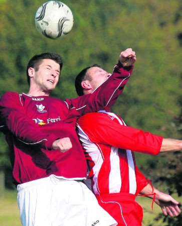 Hat-trick hero Scott Lawford wins this header against AFC Sheppey