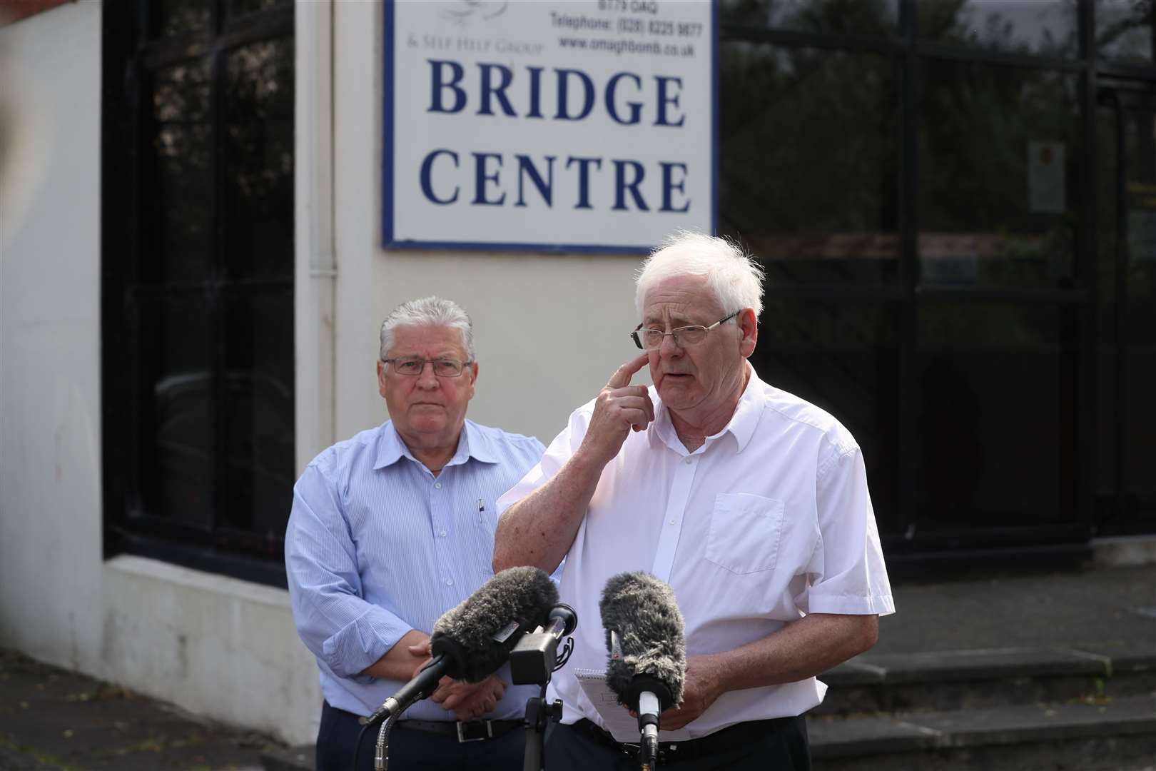 Stanley McCombe (left) and Michael Gallagher react to the Mr Justice Horner’s ruling (Brian Lawless/PA)