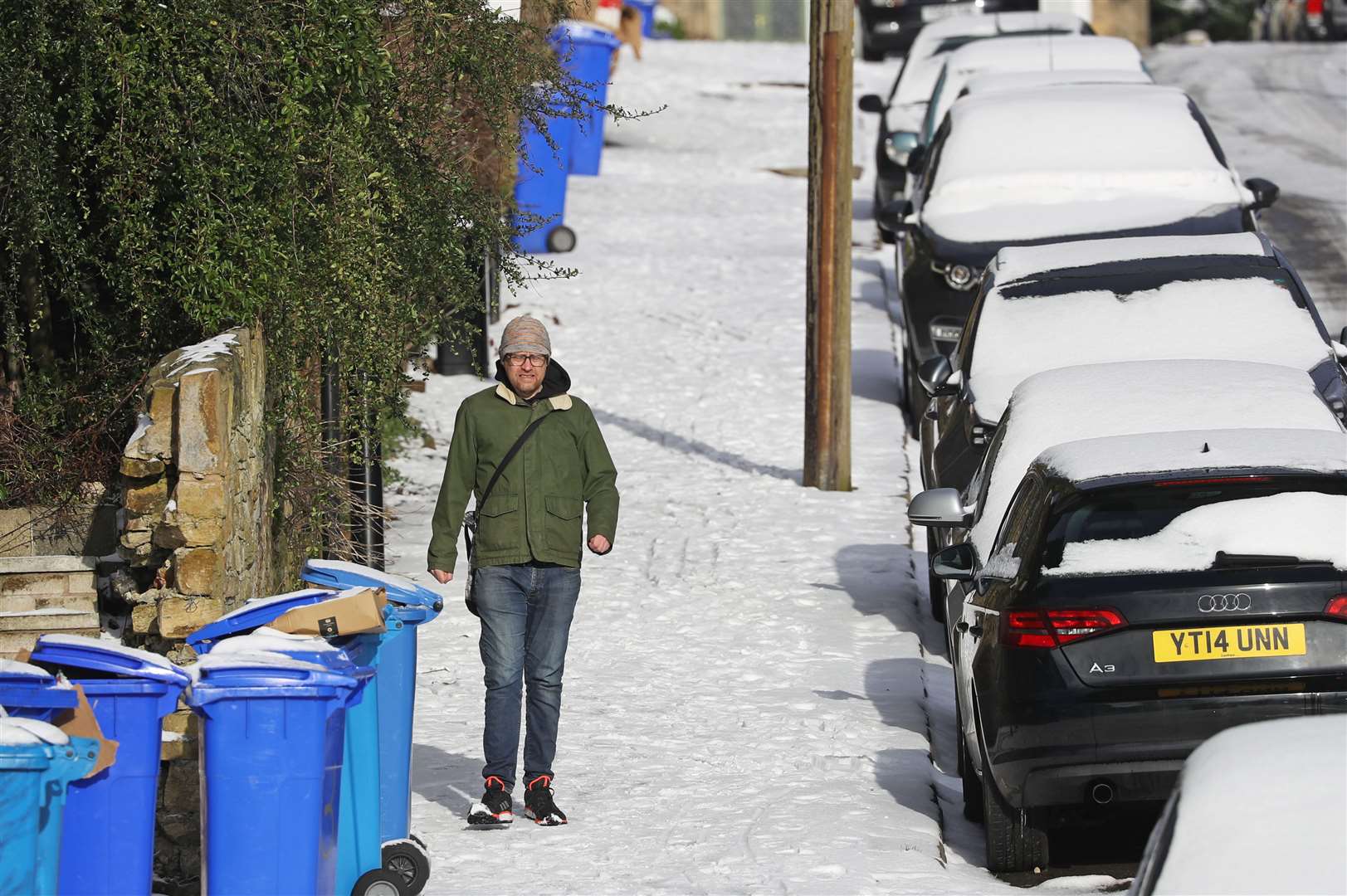 A man walks down a snow-covered street in Sheffield (Danny Lawson/PA)