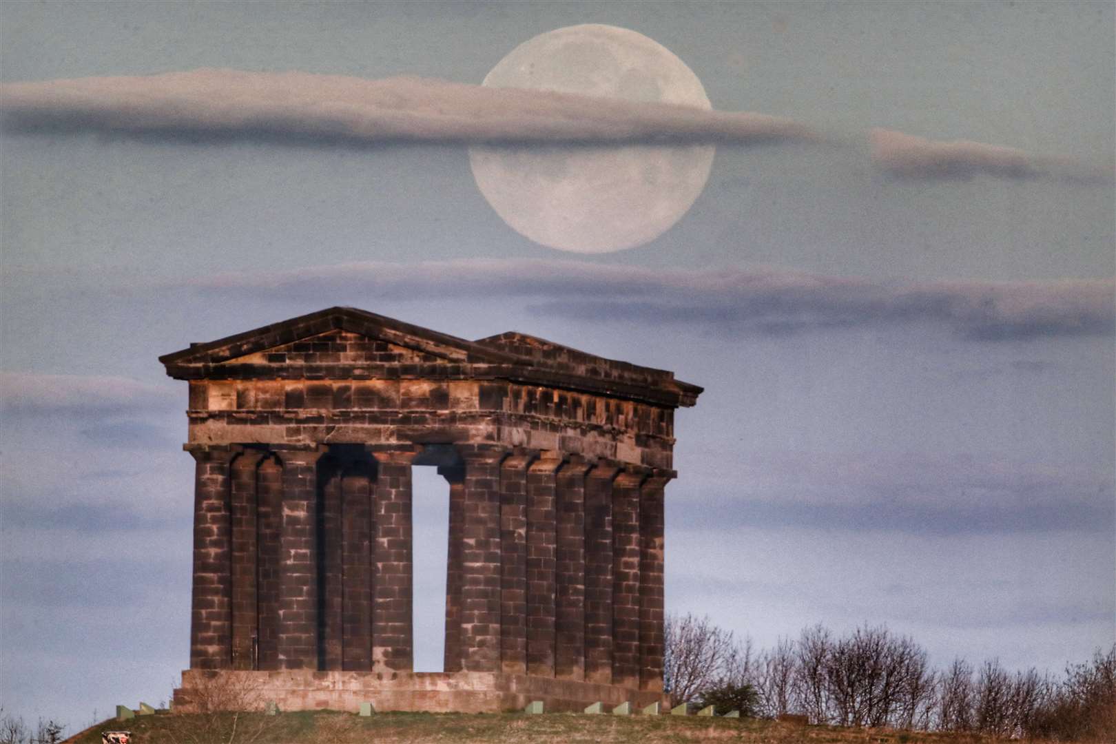 The supermoon was also seen over Penshaw monument in Sunderland (Owen Humphreys/PA)