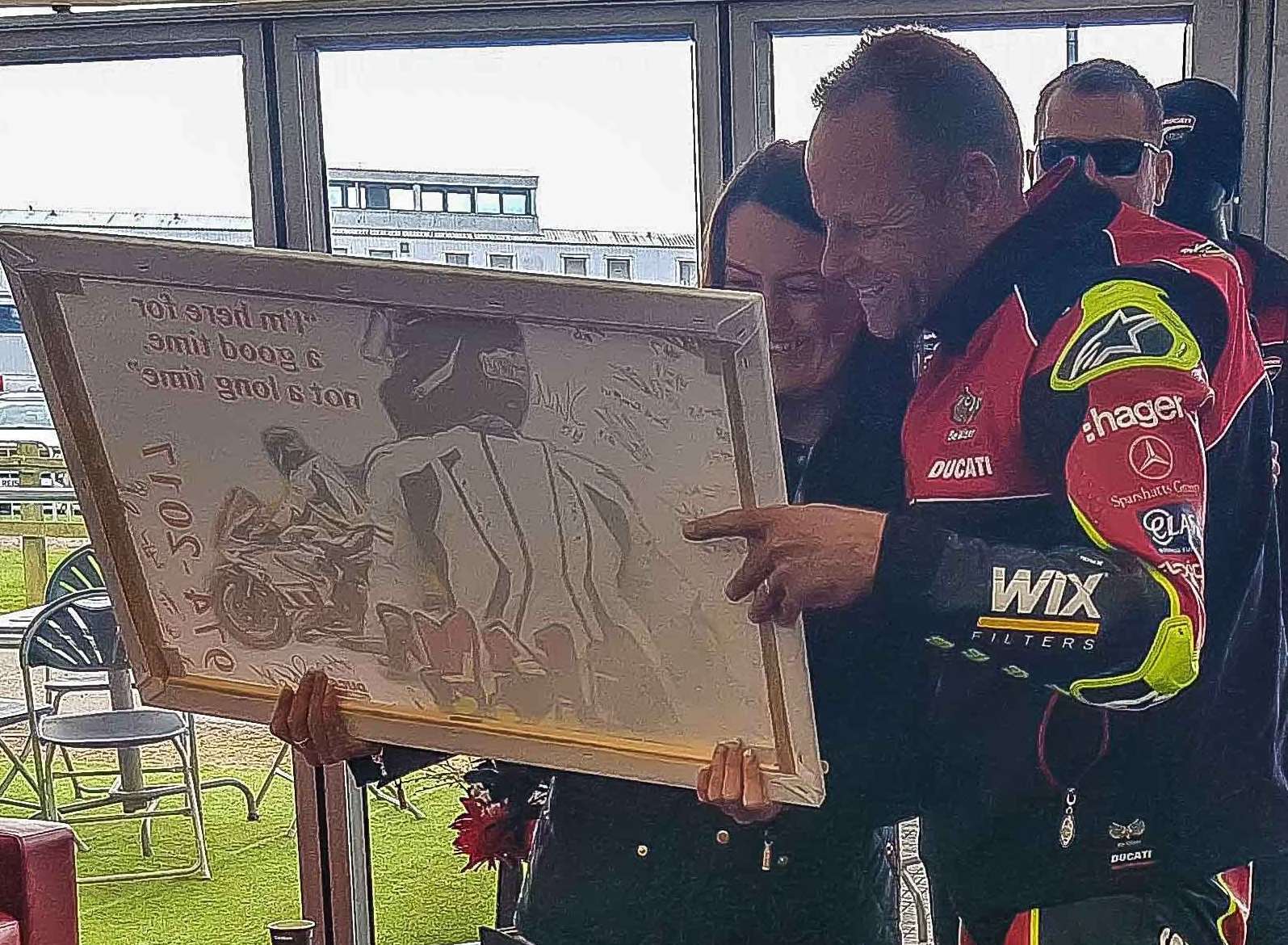 Shane Byrne presents Mick Whalley’s girlfriend Kayleigh Shoebridge with Camilla Temple-Court’s tribute Picture: CAMIPIX