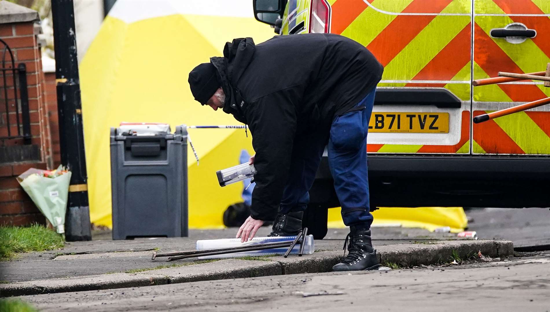 Police at the scene (Peter Byrne/PA)