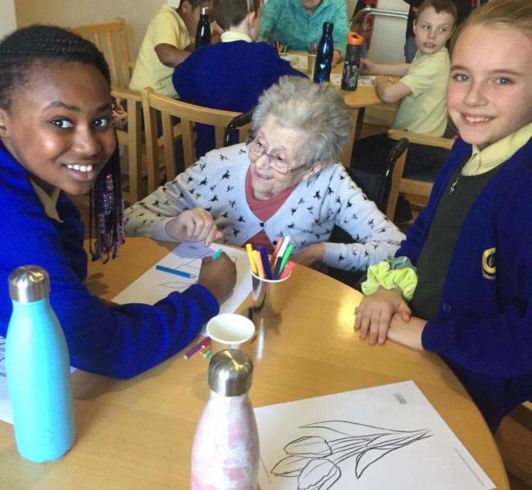 Craylands Primary school pupils socialising with a resident at Haslington Lodge prior to the lockdown