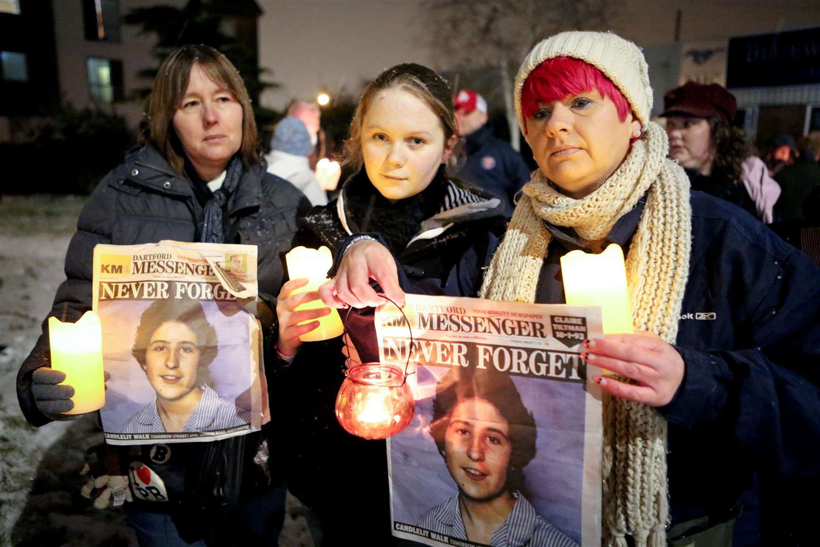 People held up copies of the front page paying tribute to Claire at the memorial walk. Picture: Matthew Walker