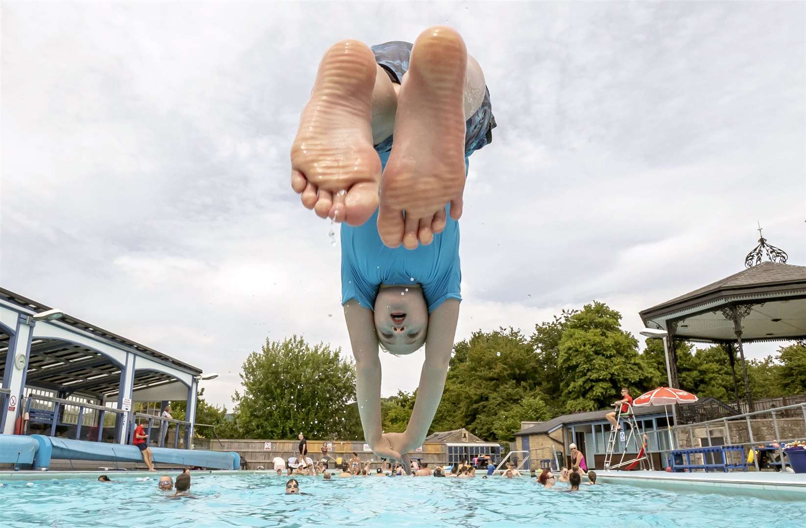 A child in the hot weather at Hathersage open air swimming pool at Hope Valley, near Sheffield (Danny Lawson/PA)