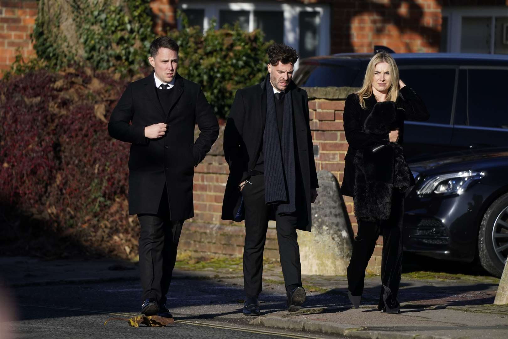 Chris Stark (left) and Jordan North (centre) arrive for the funeral service of One Direction singer Liam Payne at St Mary’s Church in Amersham, Buckinghamshire (PA)