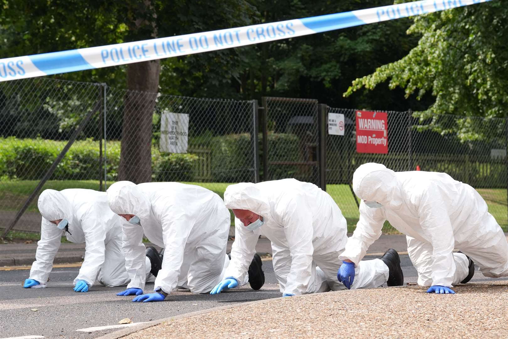 Forensic officers search the scene in Sally Port Gardens in Gillingham on Wednesday (Gareth Fuller/PA)