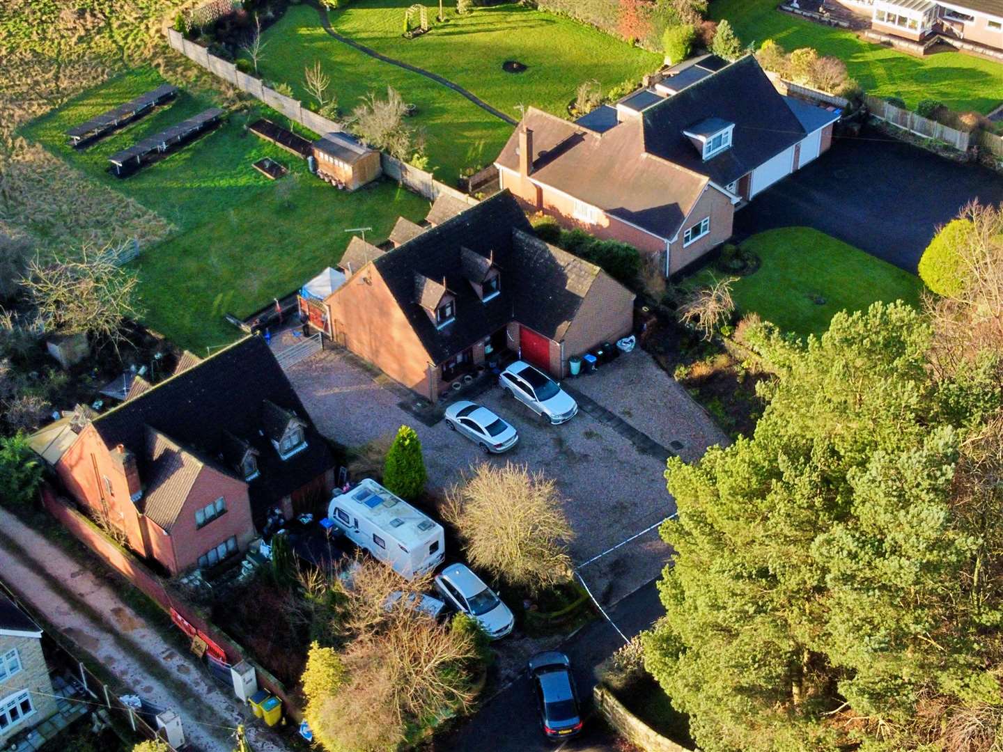 A police tent has been installed in the garden of the property (Peter Byrne/PA)