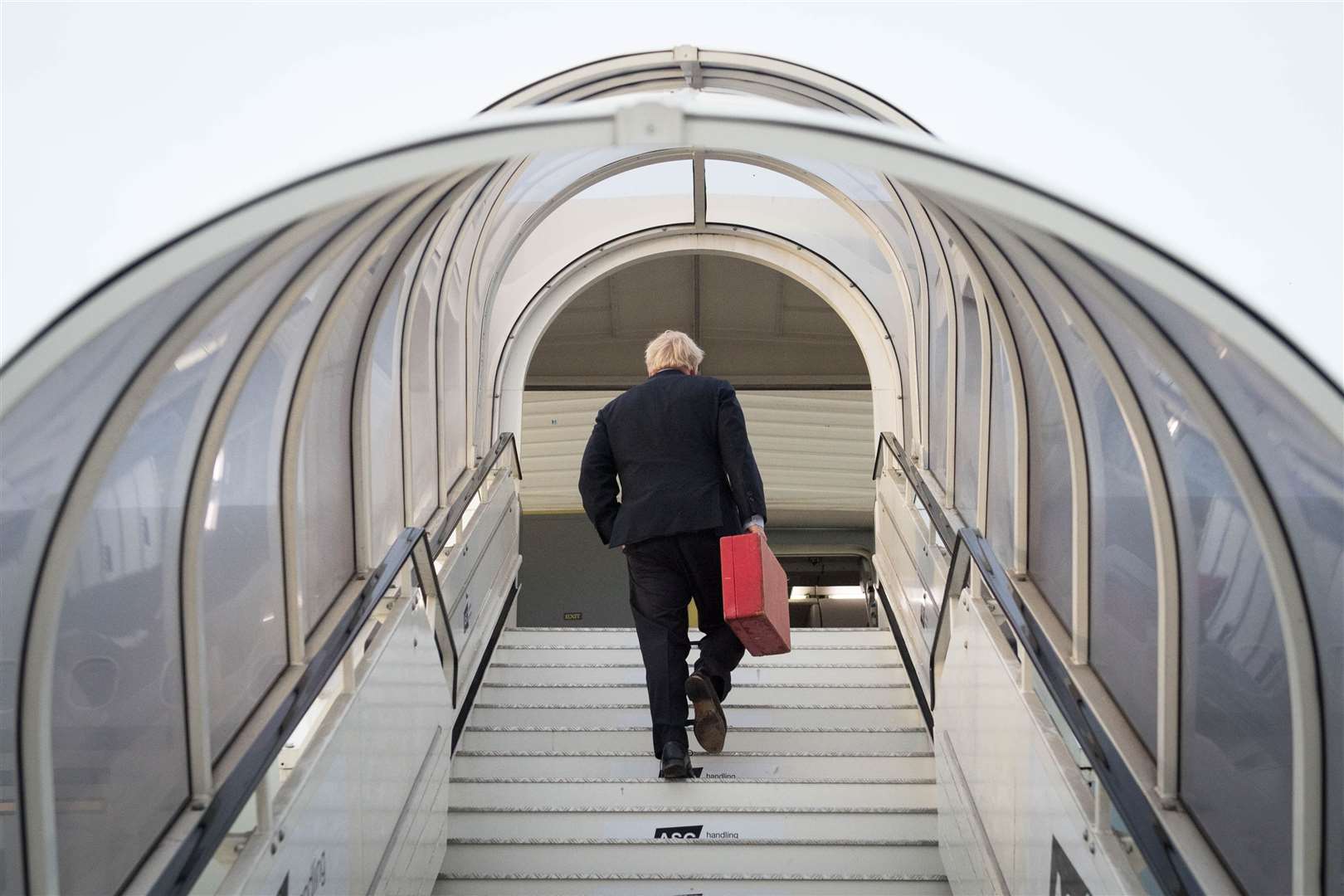 Prime Minister Boris Johnson boarding his plane at Heathrow (Stefan Rousseau/PA)