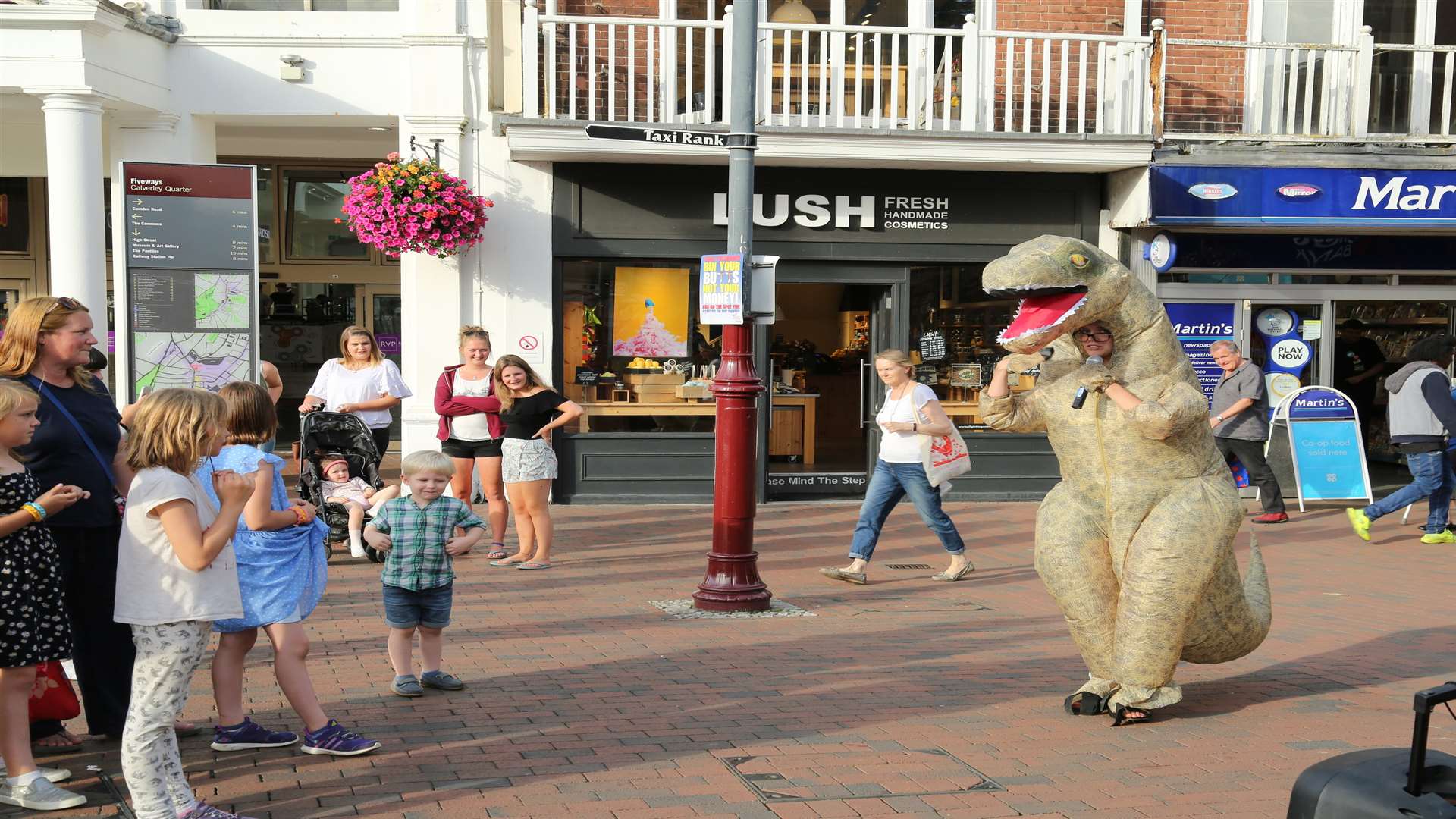 Philippa Baines dressed as a t-rex and rapped to raise awareness about climate change