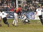 Sittingbourne keeper Chris Lewington saves during his side's 2-0 win at rivals Dover. Picture: Terry Scott