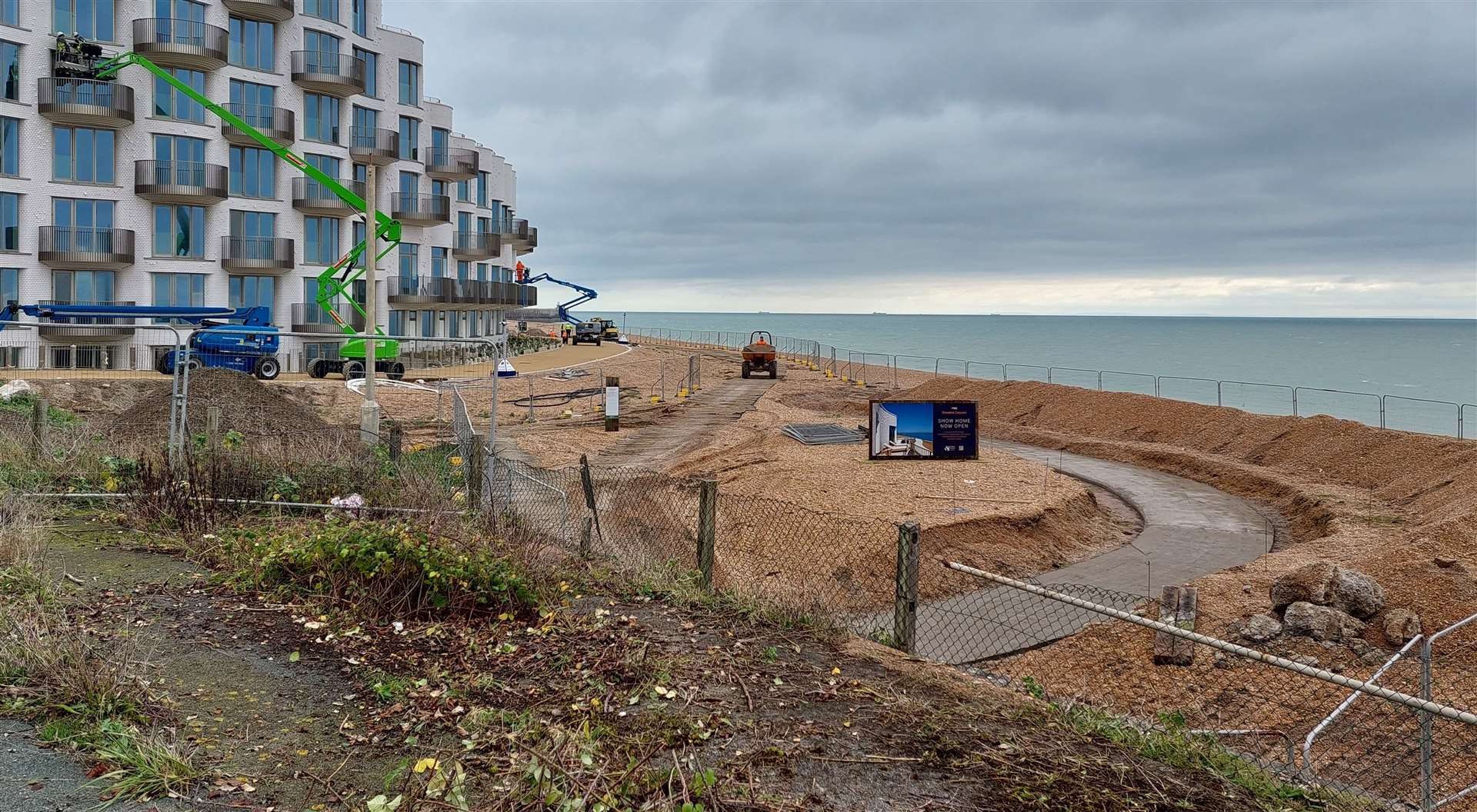 A new section of the boardwalk is being dug out in front of the Shoreline flats on Folkestone seafront