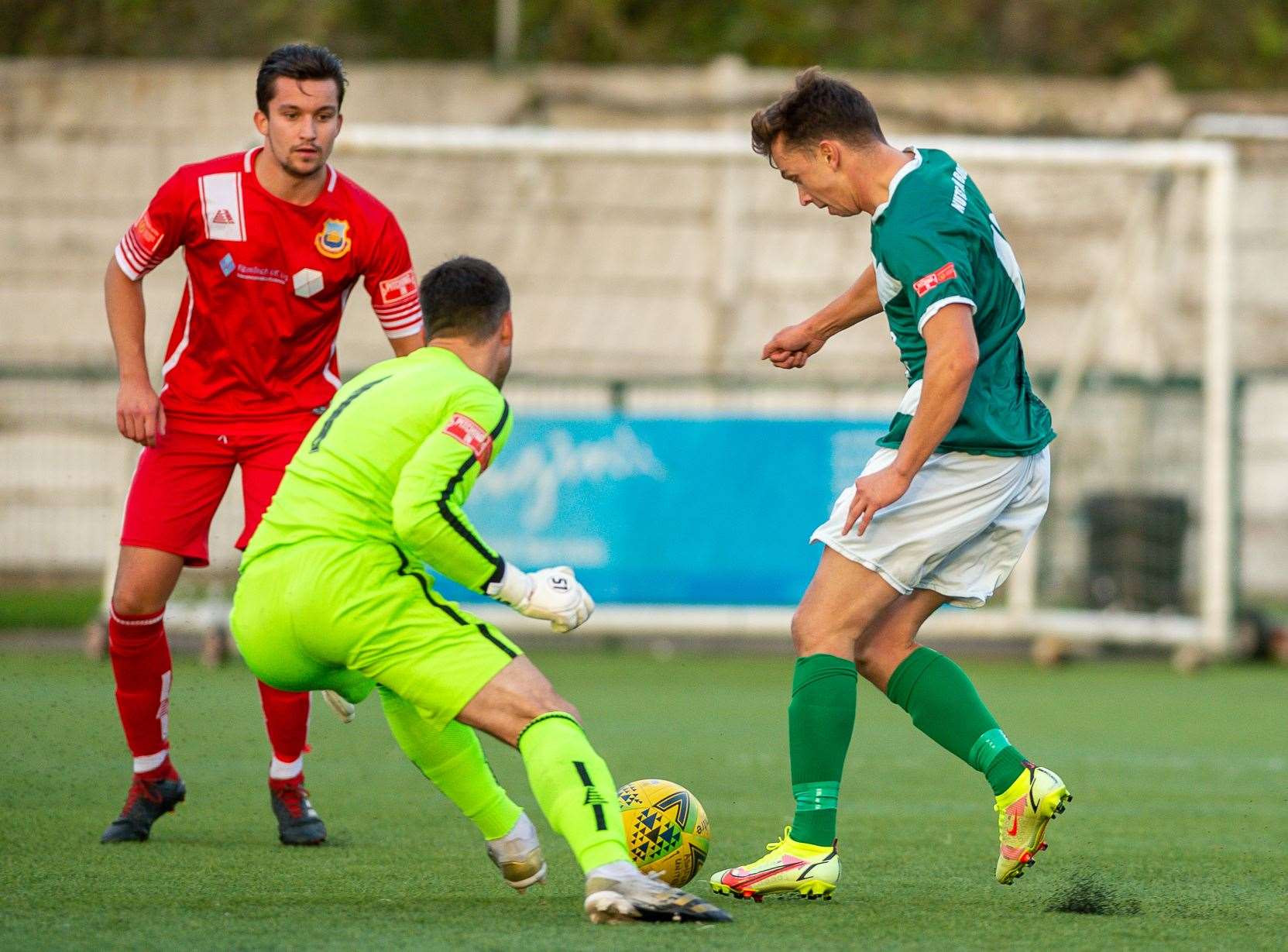 Ashford United striker Johan ter Horst takes the ball past the keeper... Ian Scammell