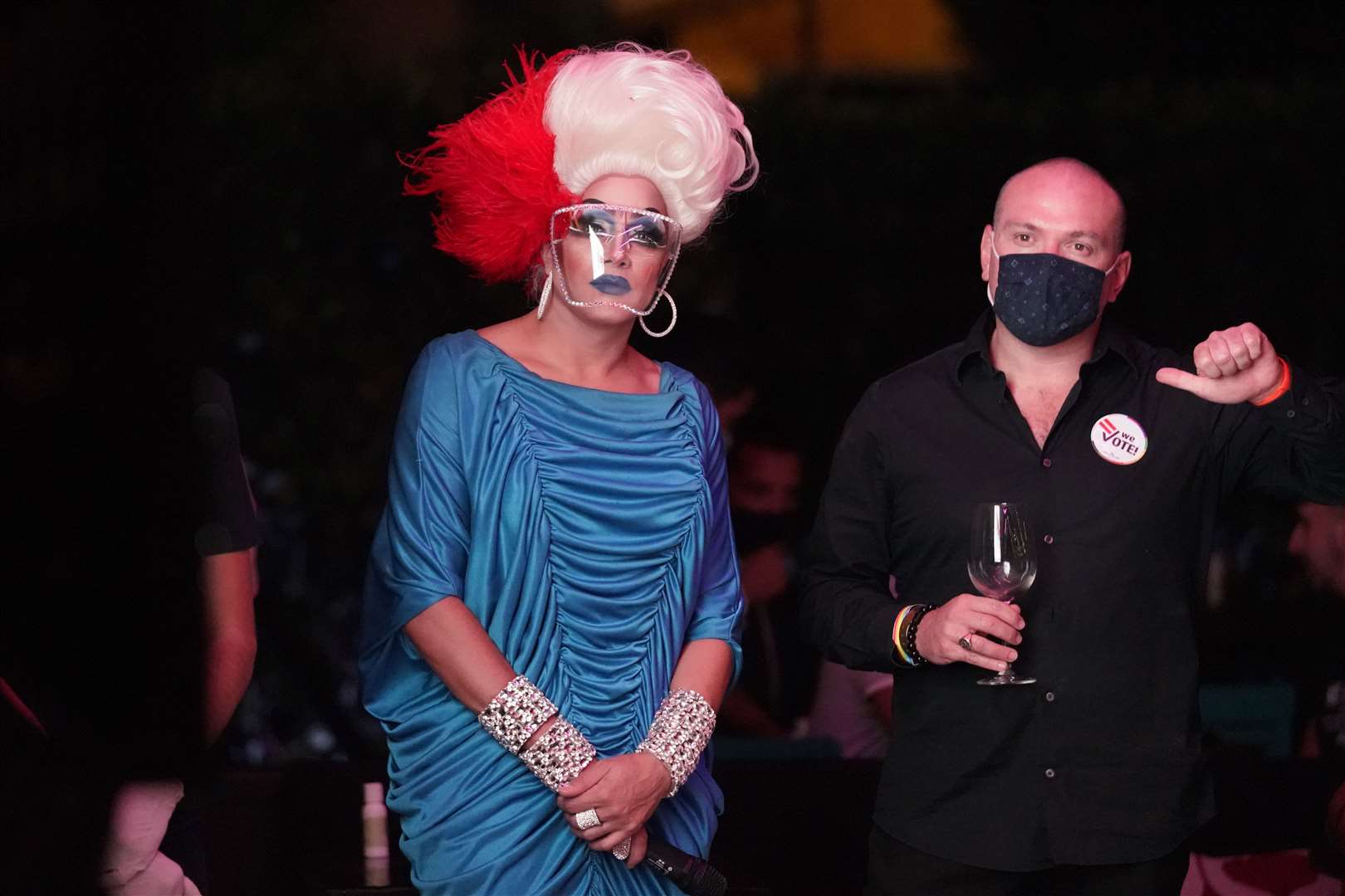 Drag queen Athena Dion, left, and Orlando Gonzales, executive director of Safeguarding American Values for Everyone (SAVE) at an Election Night watch party and drag show in Miami, Florida (Wilfredo Lee/AP)