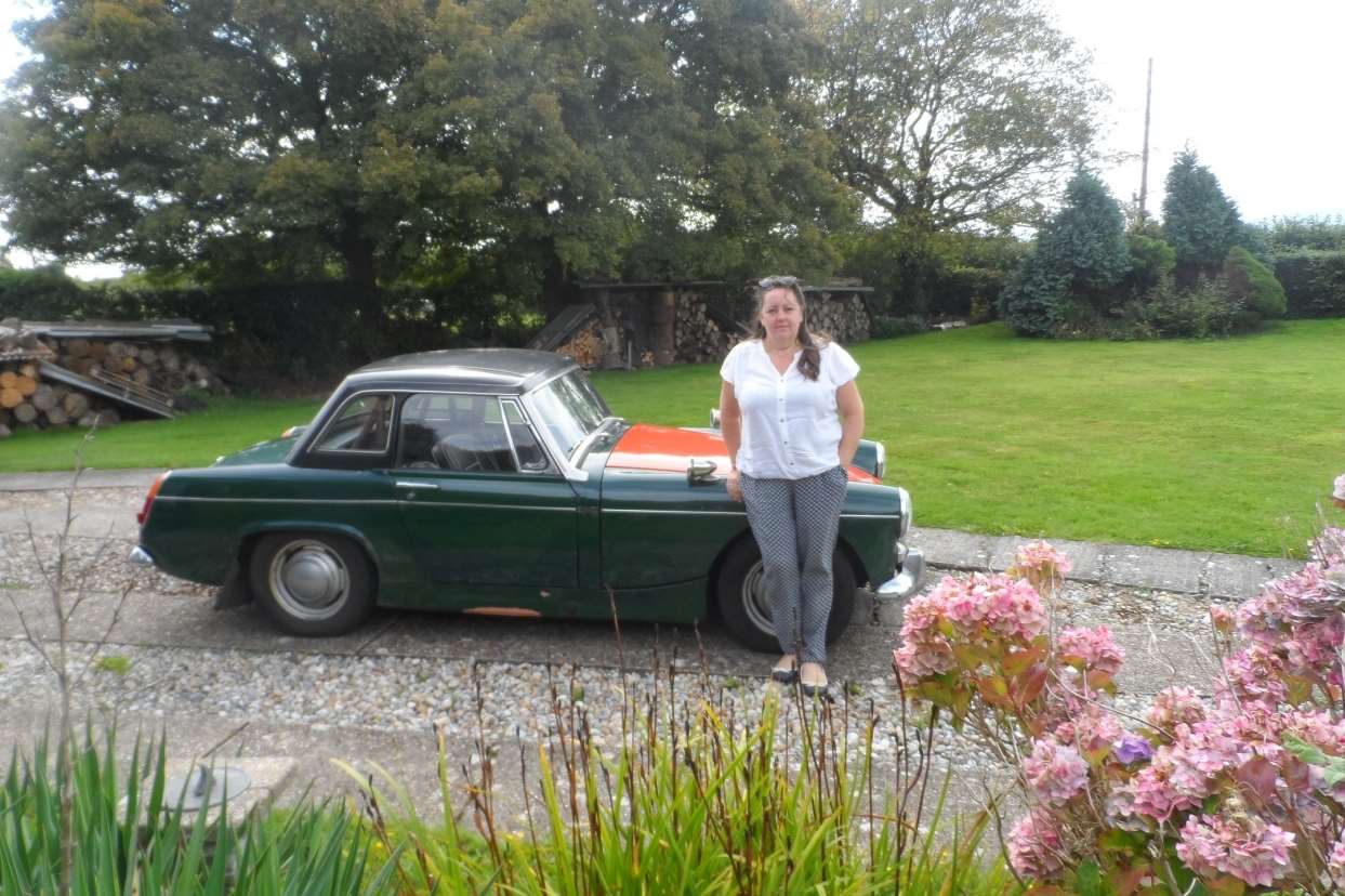 Zoe Snell with the car 40 years later