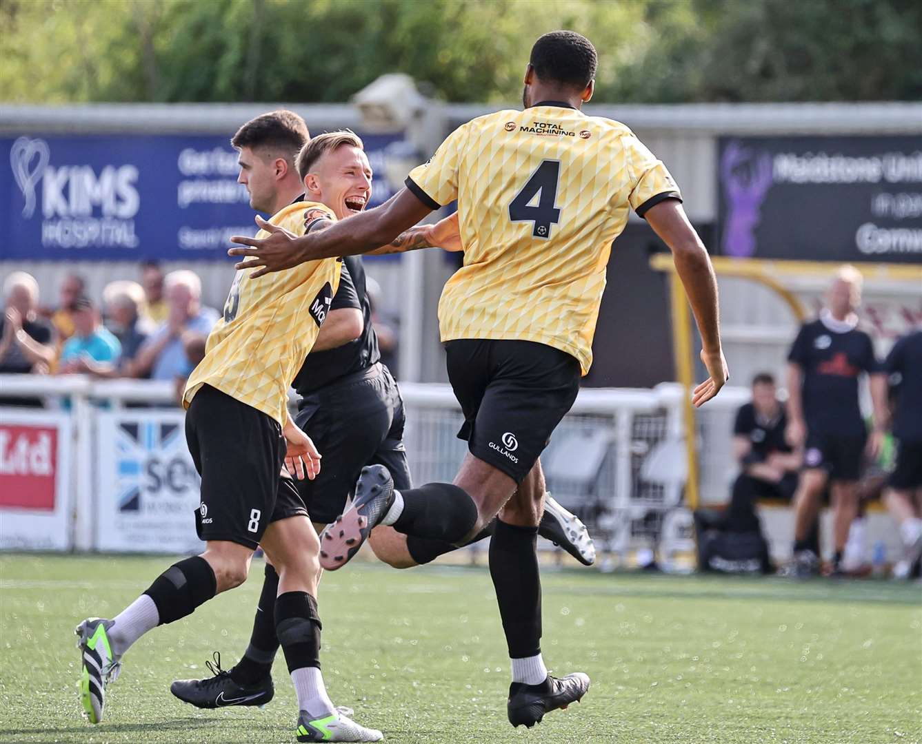 Maidstone substitute Reiss Greenidge (No.4) celebrates his equaliser with skipper Sam Corne. Picture: Helen Cooper