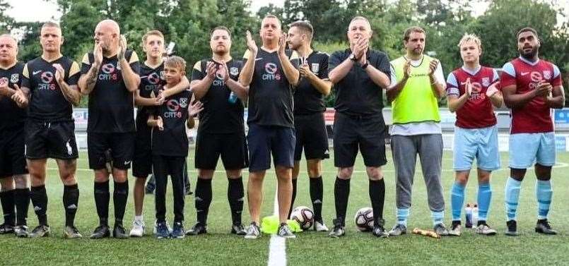 A two-minute applause is held at the Reece Watson memorial match at Maidstone United's Gallagher Stadium. Picture supplied by Matthew Murray