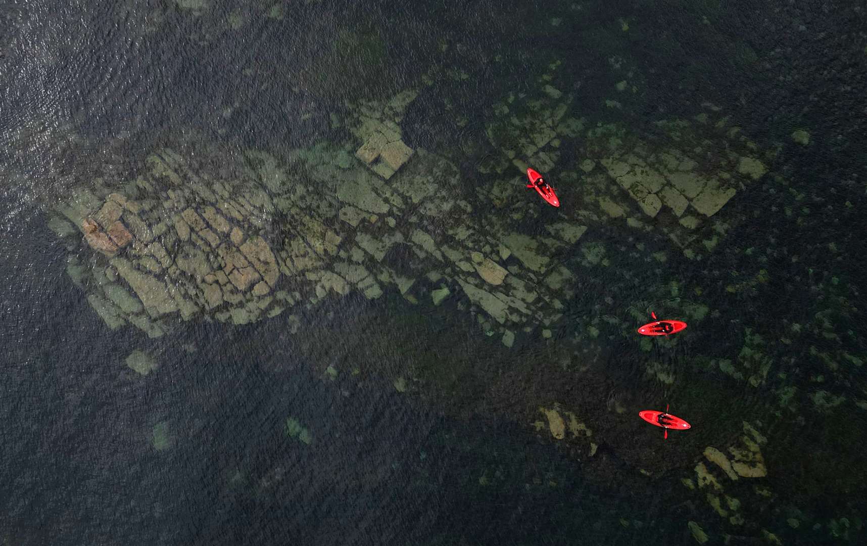 A month later and temperatures soared, with it later confirmed to have been the hottest June on record for the UK. Here, kayakers kept cool in calm conditions at Cullercoats bay in North Tyneside (Owen Humphreys/PA)