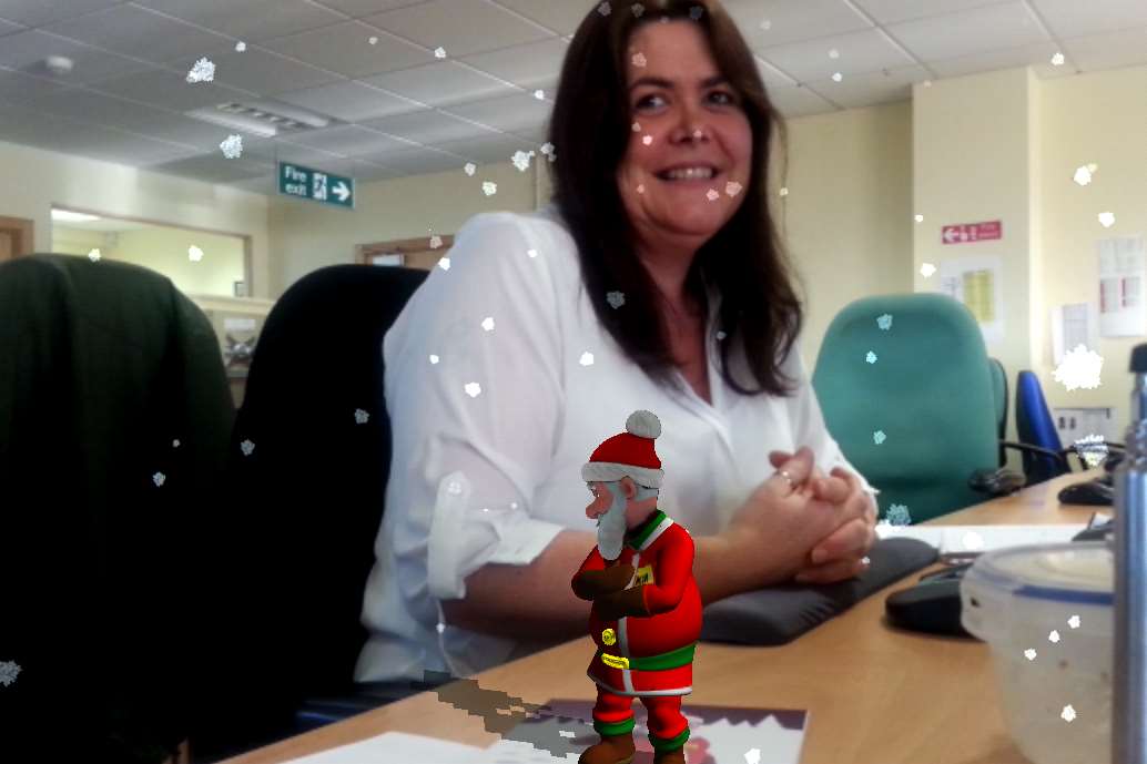 Lisa Daniels and Father Christmas on the KM Group's production desk